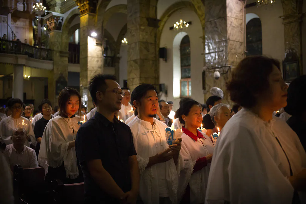 Members of the faithful attend a mass at the Cathedral of the Immaculate Conception, a government-sanctioned Catholic church in Beijing on Sept. 22, 2018. (Mark Schiefelbein/AP)
