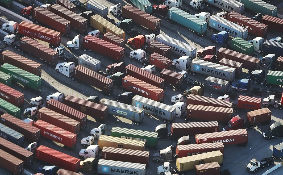 Trucks prepare to haul shipping containers at the Port of Los Angeles in San Pedro, Calif., on Sept. 18, 2018. (Mario Tama/Getty Images)