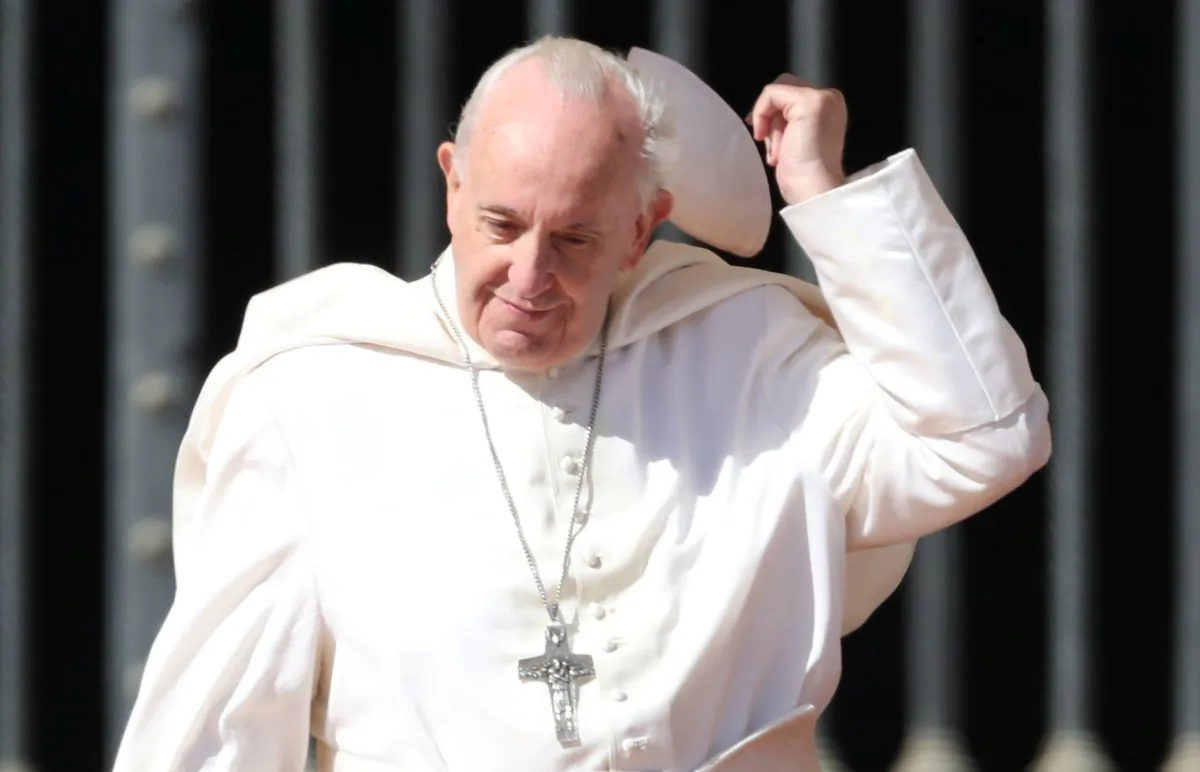 Pope Francis loses his skull cap in Saint Peter's square at the Vatican, on Sept. 26, 2018. (Tony Gentile/Reuters)