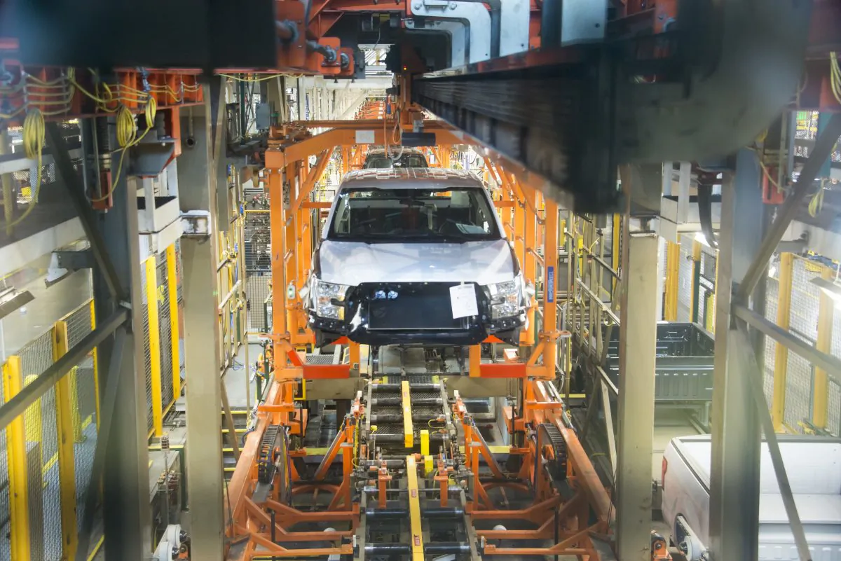 In this Feb. 10, 2015, file photo, the Observation Deck Tour gives visitors a chance to watch the Ford F-150 pick-up being produced at the Ford Rouge Factory in Dearborn, Mich. Ford is celebrating a century of production at its storied Rouge factory. The company is expected to make an announcement about the plant’s future at a ceremony Thursday, Sept. 27, 2018. (David Guralnick/AP)