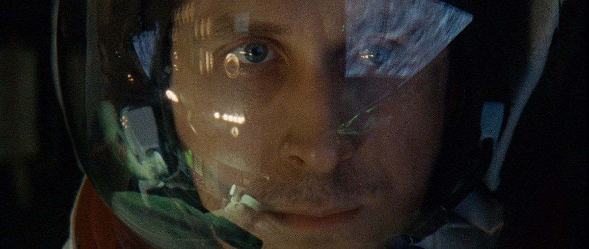 Ryan Gosling as Neil Armstrong preparing for lift-off