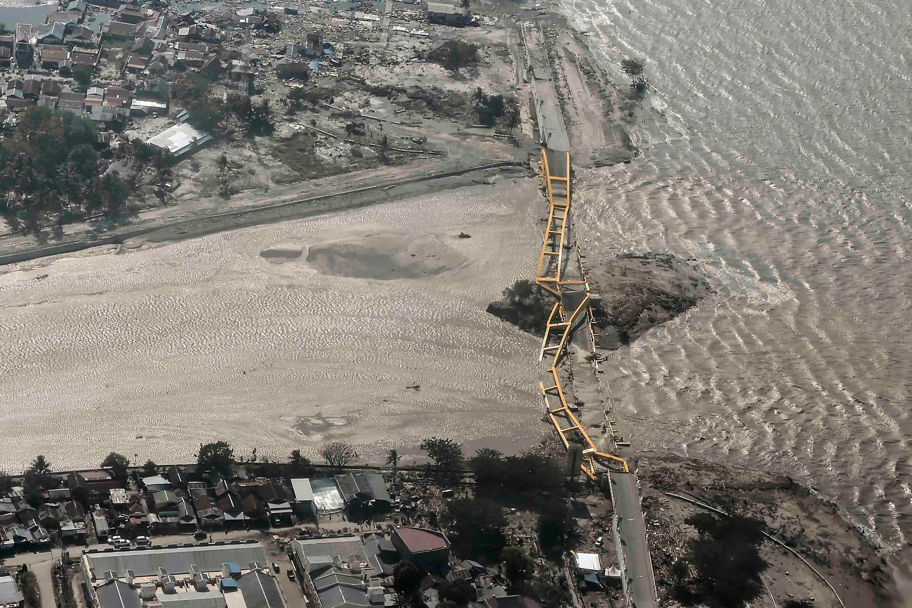 Aerial view of bridge damaged by an earthquake and tsunami in Palu, Central Sulawesi