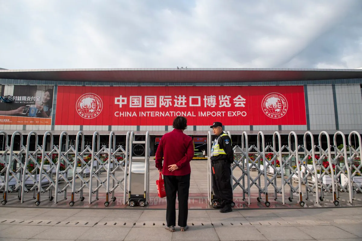 A security guard stands in front of the entrance of the National Exhibition and Convention Center (Shanghai), the main venue to hold the upcoming first China International Import Expo (CIIE), is seen in Shanghai on October 31, 2018. (JOHANNES EISELE/AFP/Getty Images)