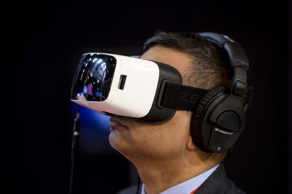 A visitor tries an IoT device at the 2015 Internet of Things Solutions World Congress in Barcelona, Spain.