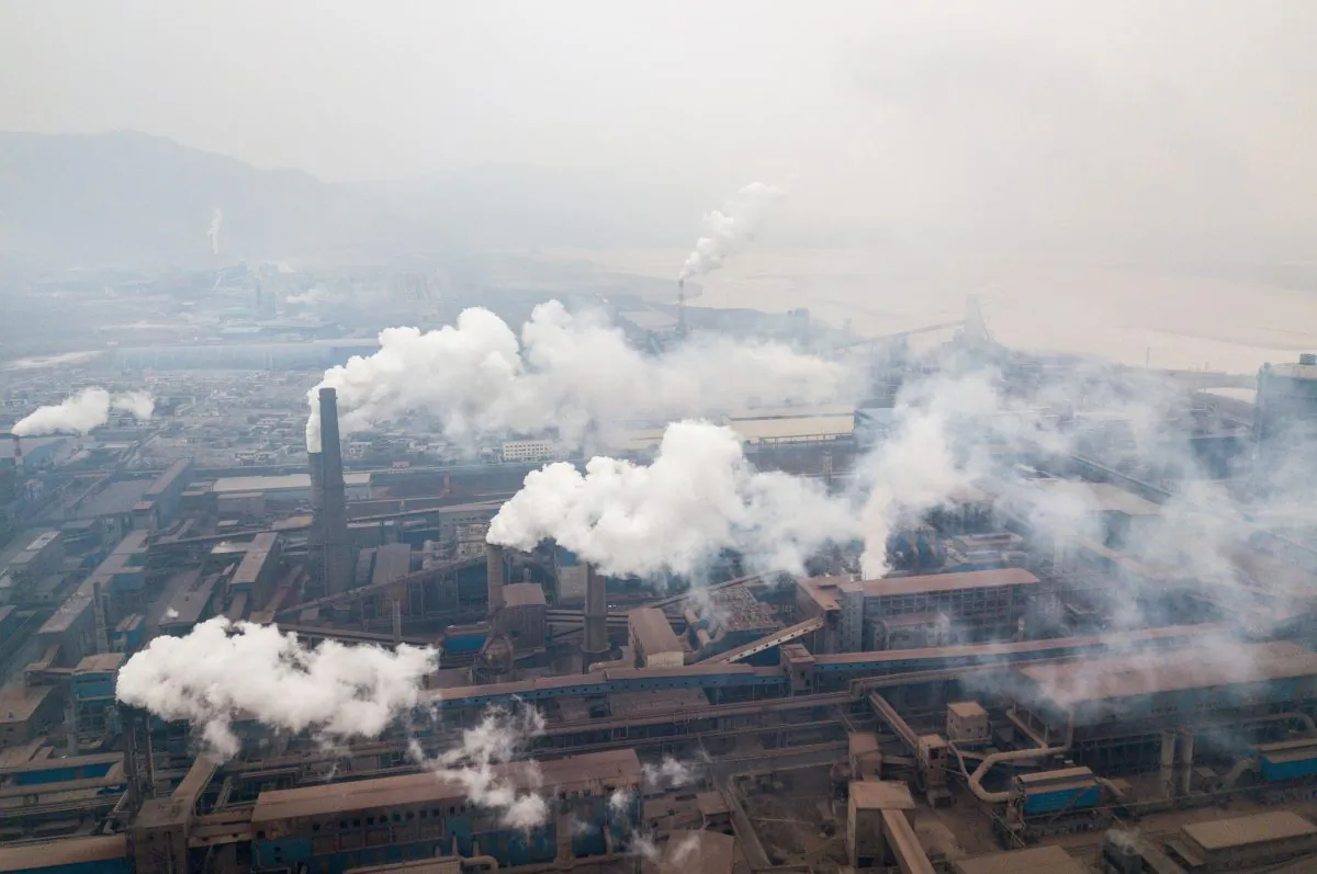 This aerial view taken with a drone shows pollution being emitted from steel factories in Hancheng, Shaanxi Province, China on Feb. 17, 2018. (Fred Dufour/AFP/Getty Images)