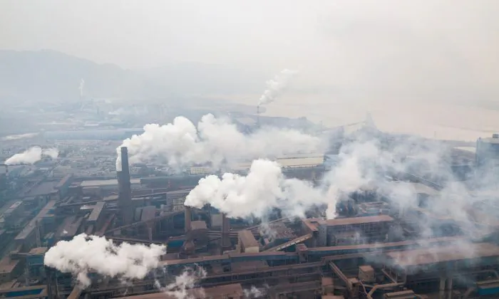 This aerial view taken with a drone shows pollution being emitted from steel factories in Hancheng, Shaanxi Province, China on Feb. 17, 2018. (Fred Dufour/AFP/Getty Images)