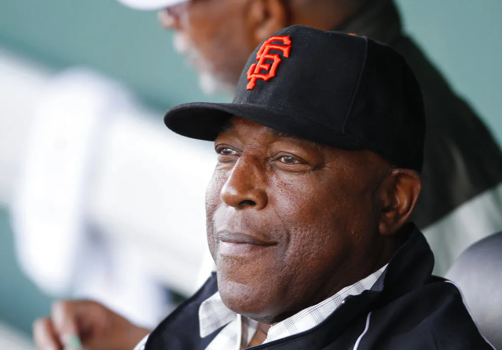 San Francisco Giants Hall of Famer Willie McCovey watches batting practice from the dugout before the Giants' spring training baseball game against the Los Angeles Dodgers in Scottsdale, Ariz. (AP Photo/Eric Risberg)