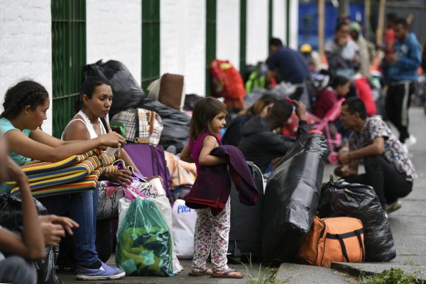 Venezuelan migrant families at a makeshift camp alongside the Cali river.