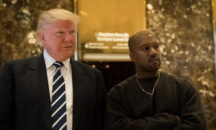 President-elect Donald Trump and Kanye West stand together in the lobby at Trump Tower in New York City on Dec. 13, 2016. (Drew Angerer/Getty Images)
