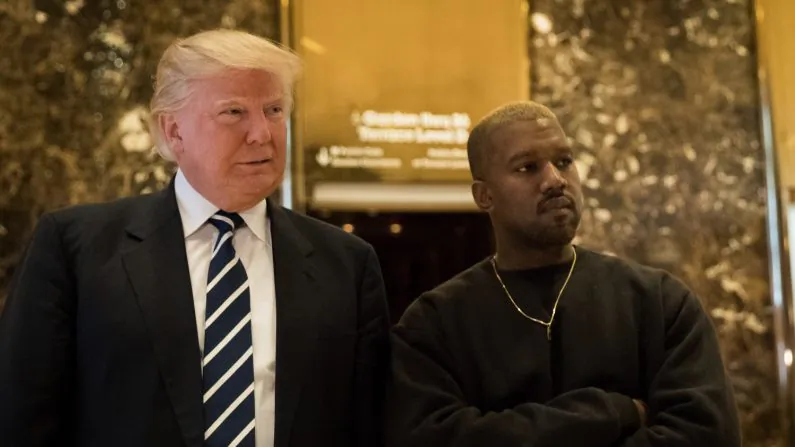 President-elect Donald Trump and Kanye West stand together in the lobby at Trump Tower in New York City on Dec. 13, 2016. (Drew Angerer/Getty Images)