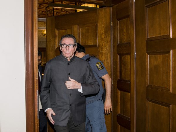 Jean-Claude Arnault leaves the court room