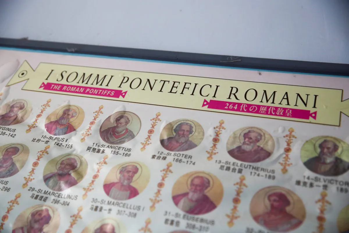 A poster showing the portraits of popes is seen at a Catholic underground church near the village of Huangtuang, Hebei province, China, September 30, 2018.   (Thomas Peter/Reuters)