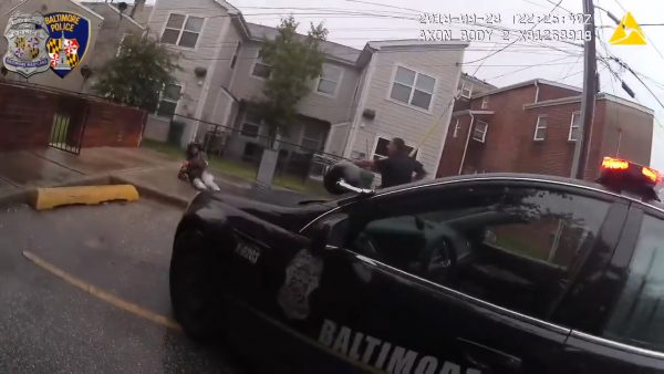Police officer talks to a suspect