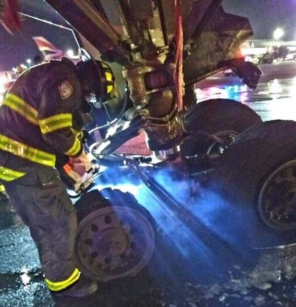 Fire fighter inspects the landing gear
