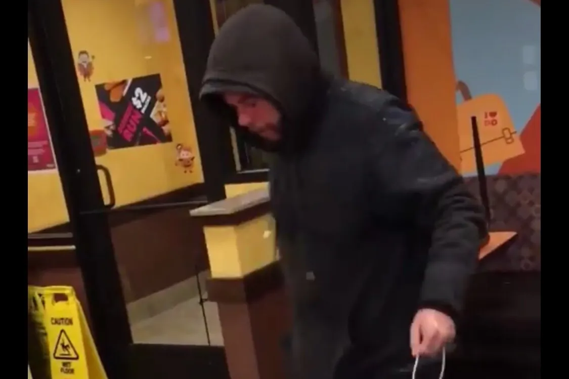 A Syracuse, N.Y. man had water dumped on him in a Dunkin' recently. The incident was recorded and the video went viral online, prompting many to call for the worker who dumped the water to be fired. The company announced on Oct. 1, 2018 that the worker was fired. (Man sleeping at Suyracuse Dunkin/GoFundMe)