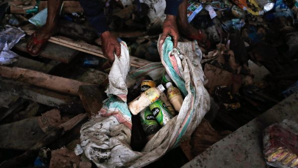 man beverages scavenged abandoned warehouse