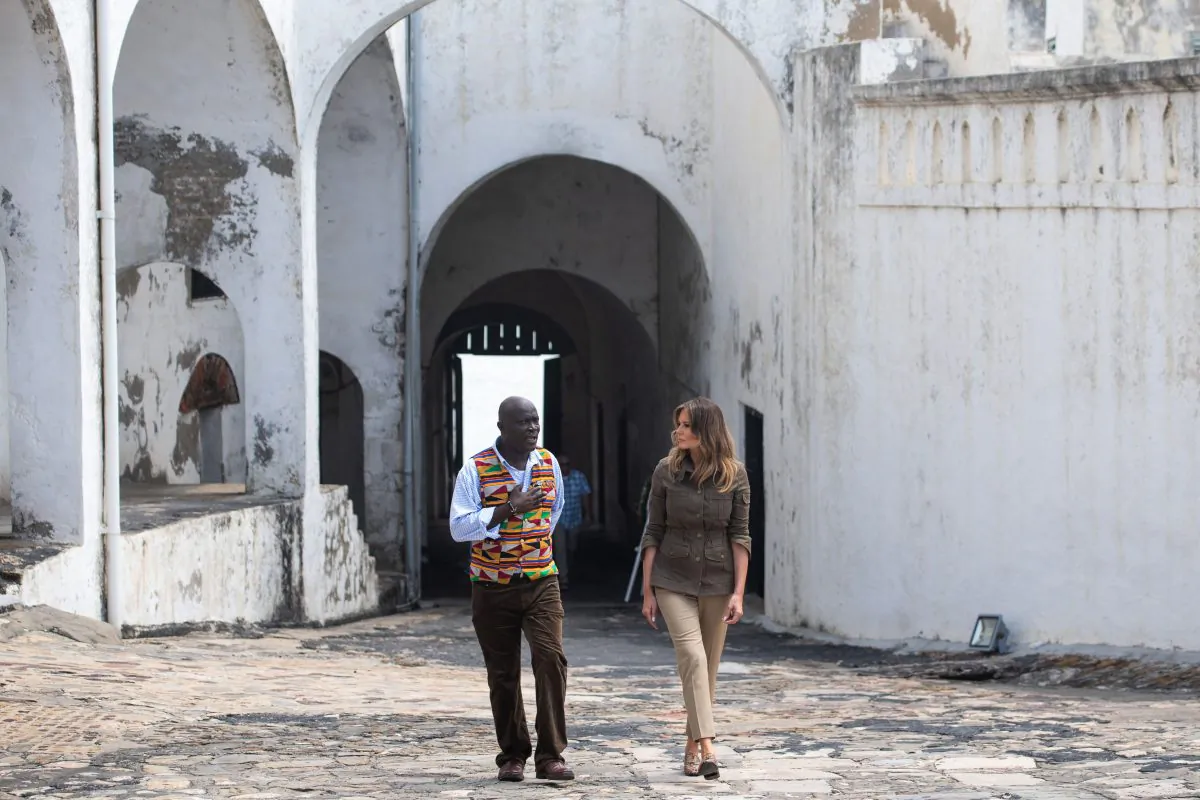 U.S. First Lady Melania Trump (R) and Kwesi Essel Blankson, museum educator, tour the Cape Coast Castle, a former slave trading fort, in Cape Coast, Ghana, on Oct. 3, 2018. (Saul Loeb/AFP/Getty Images)