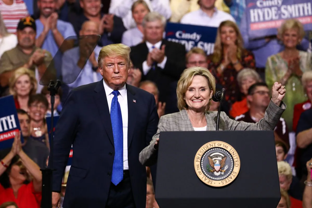 President Donald Trump and Sen. Cindy Hyde-Smith (R-Miss.) at a Make America Great Again rally in Southaven, Miss., on Oct. 2, 2018. Hyde-Smith has caused a media storm over remarks she made about "public hangings," with opponents accusing her of being racist. (Charlotte Cuthbertson/The Epoch Times)