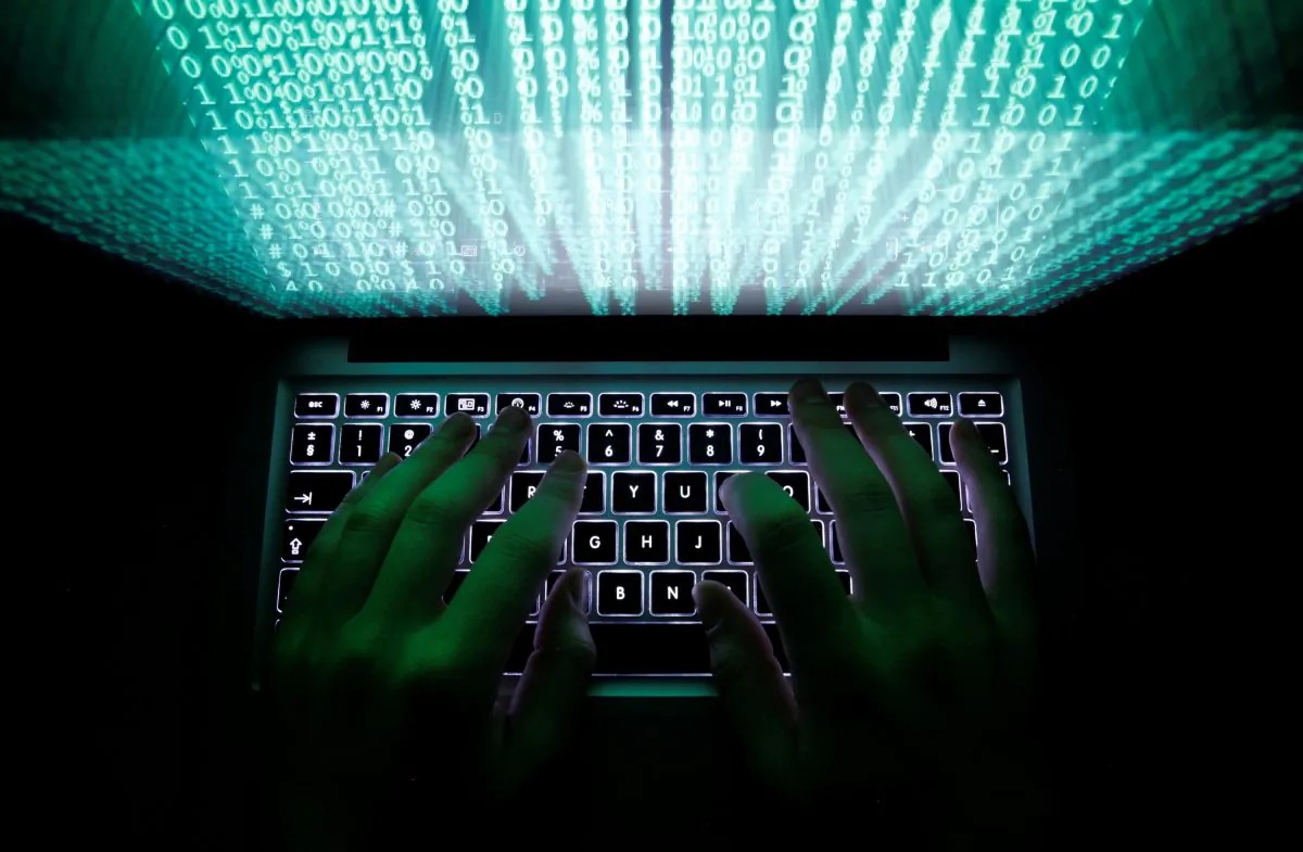 A man types on a computer keyboard in Warsaw on Feb. 28, 2013. (Kacper Pempel/Reuters)