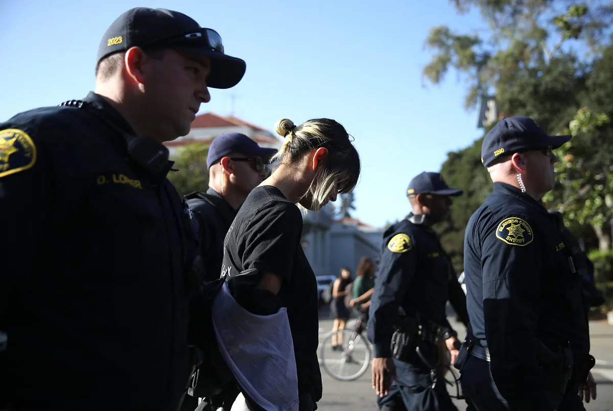A protester is arrested by Alameda County sheriff during a demonstration outside of Zellerbach Hall on the U.C. Berkeley campus in Berkeley, California on Sept. 14, 2017. (Justin Sullivan/Getty Images)