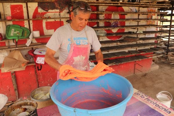 Chava Reyes at work making fuses for his fireworks products in Tultepec, Mexico.