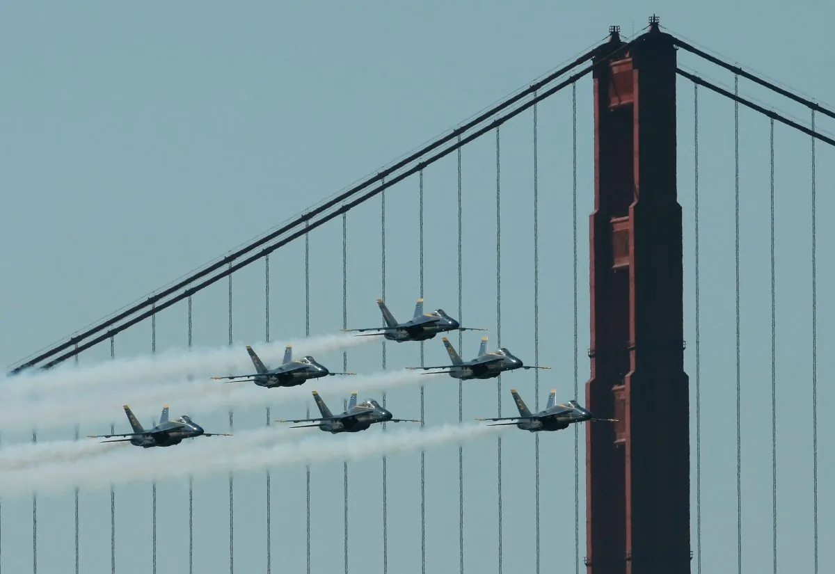 F/A-18 Hornets of the U.S. Navy Blue Angels fly by the Golden Gate Bridge as they practice their Fleet Week performance in San Francisco. San Francisco kicks off its annual Fleet Week celebration with the parade of ships and an air show featuring the Blue Angels. (Justin Sullivan/Getty Images)