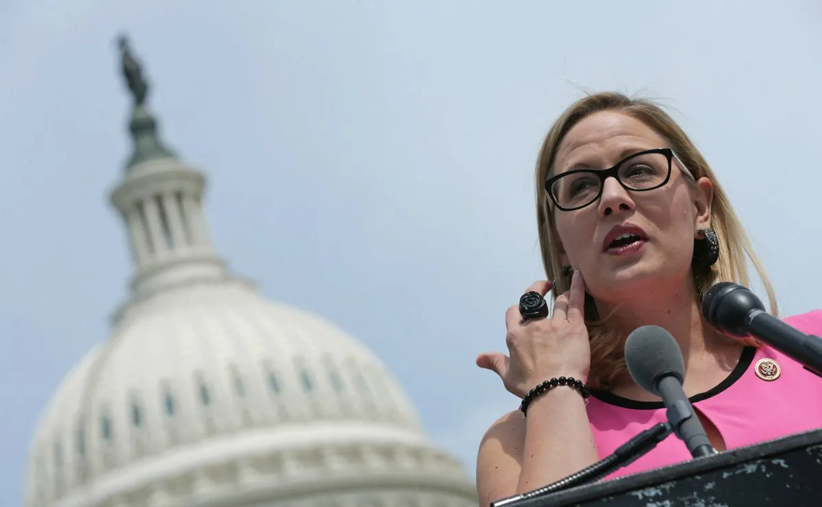 Rep. Kyrsten Sinema (D-Ariz.) joins a group of bipartisan Congressmen during a news conference outside the U.S. Capitol May 20, 2014 in Washington, DC. (Chip Somodevilla/Getty Images)