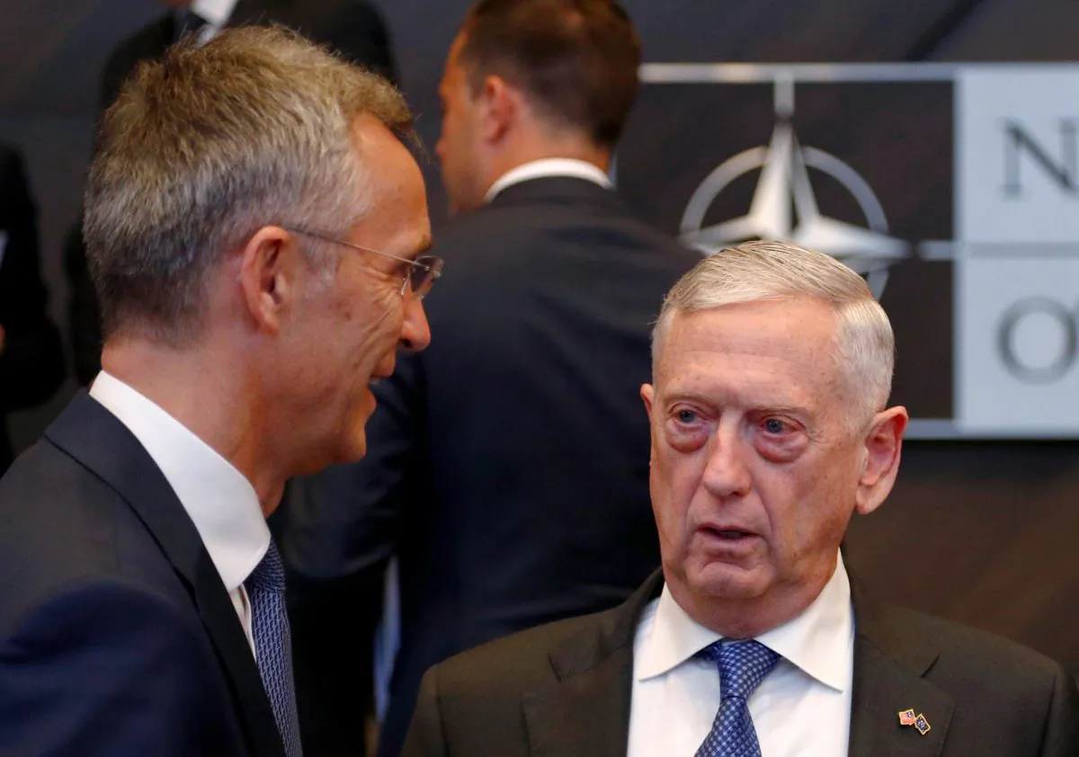 NATO Secretary-General Jens Stoltenberg talks with U.S. Secretary of Defense Jim Mattis during a NATO defence ministers meeting at the Alliance headquarters in Brussels, Belgium, on Oct. 4, 2018.  (Francois Lenoir/Reuters)