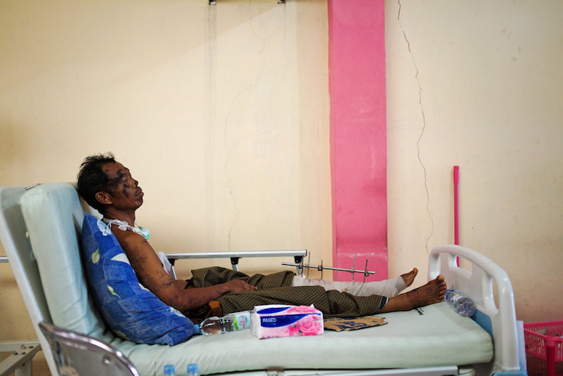 earthquake victom on hospital bed in sulawesi