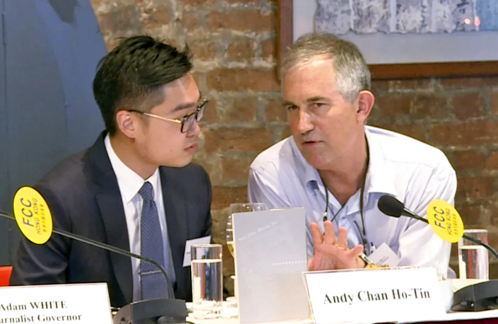 The Financial Times Asia news editor, Victor Mallet (right) speaks with Andy Chan, founder of the Hong Kong National Party, during a luncheon at the Foreign Correspondents Club in Hong Kong on Aug. 14, 2018. (AP)