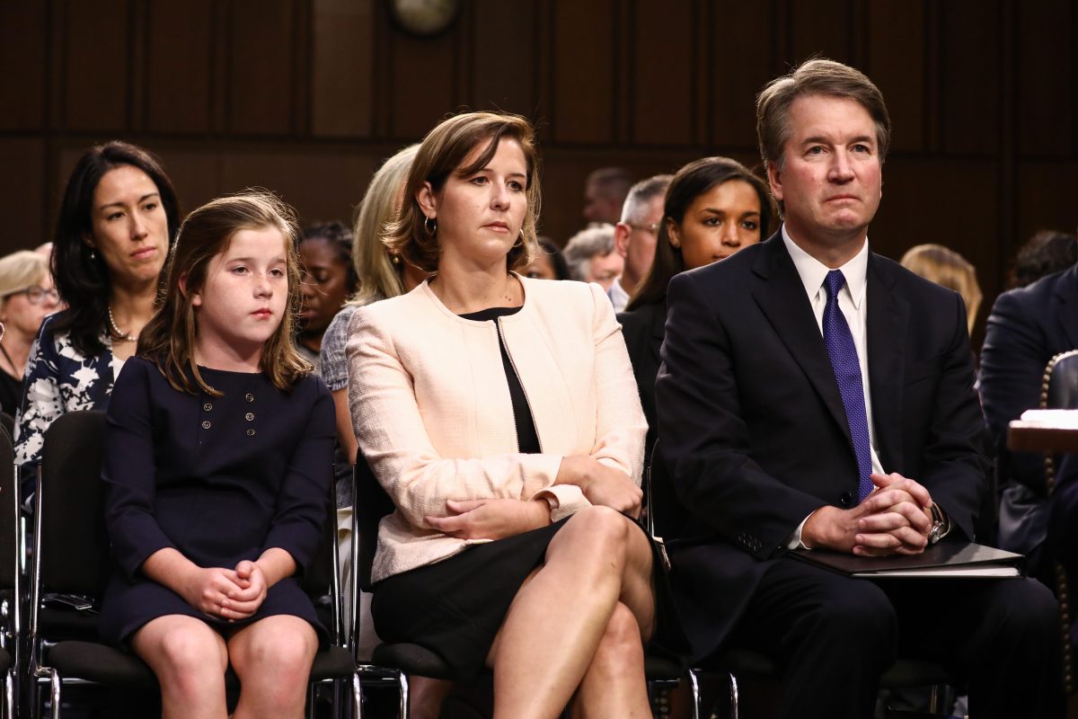 kavanaugh at a hearing with his wife and daughter