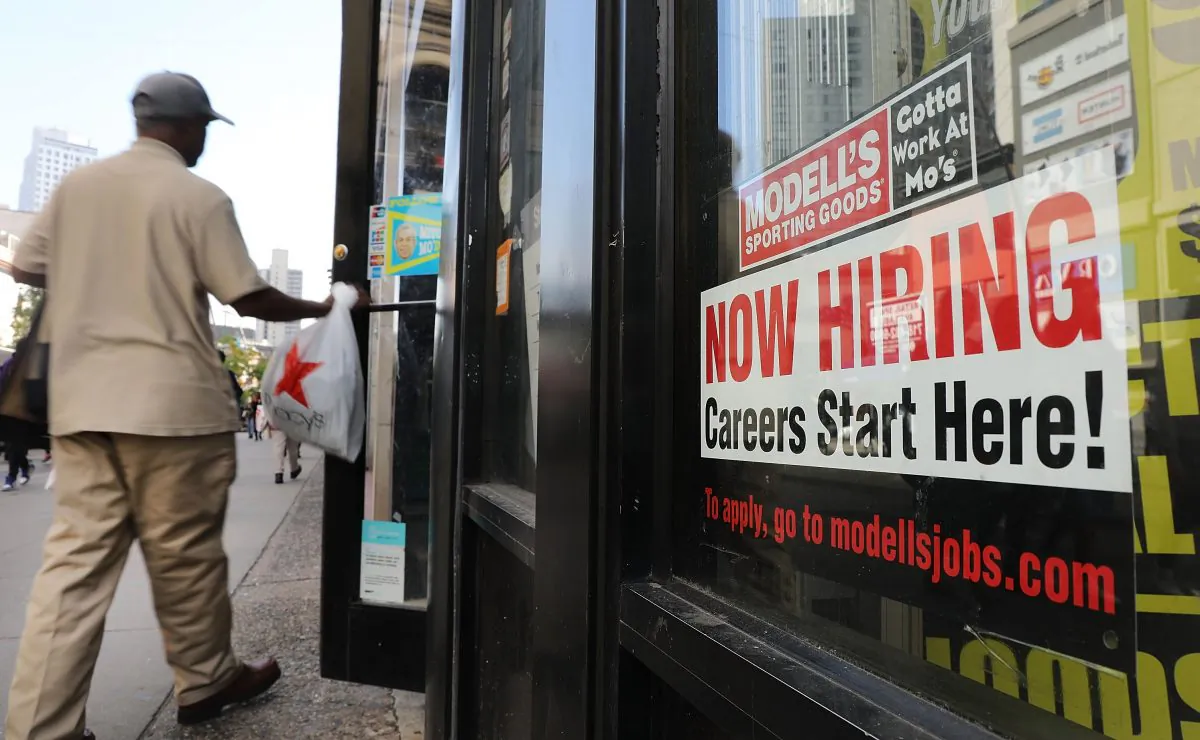 A now hiring sign in the window of a Brooklyn business in New York on Oct. 5, 2018. (Spencer Platt/Getty Images)