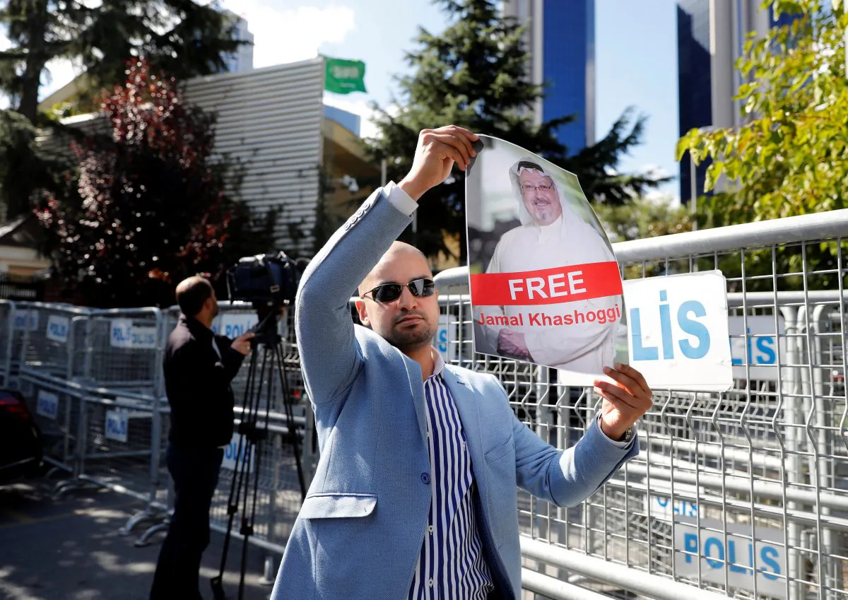 A demonstrator holds a picture of Saudi journalist Jamal Khashoggi during a protest in front of Saudi Arabia's consulate in Istanbul, Turkey, on Oct. 5, 2018. (Osman Orsal/Reuters)