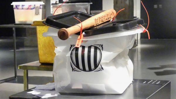 A ballot box smashed by a baton