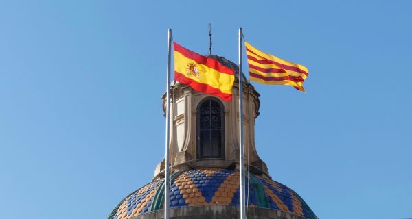 The Catalan and Spanish flags on Palau de la Generalitat.