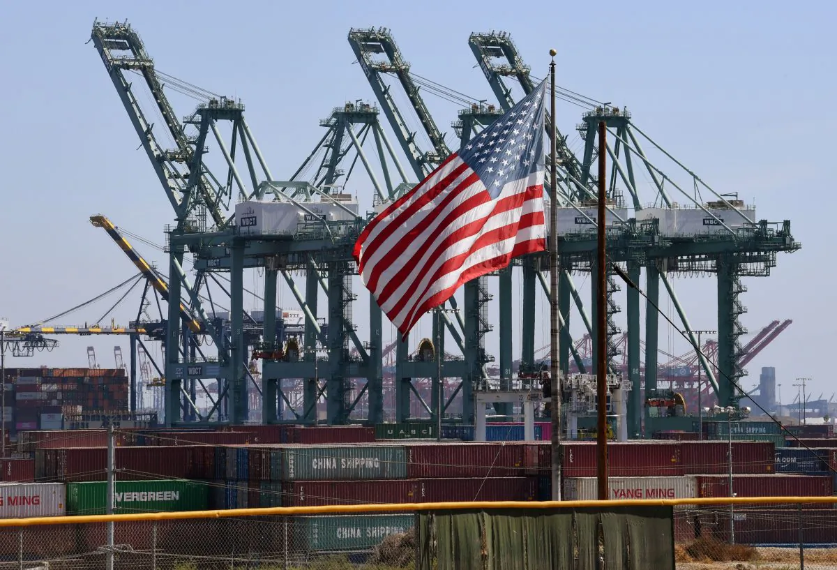 The U.S. flag flies over Chinese shipping containers at the Port of Long Beach in Los Angeles County on Sept. 29, 2018. (Mark Ralston/AFP/Getty Images)