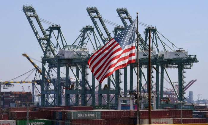 The U.S. flag flies over Chinese shipping containers at the Port of Long Beach in Los Angeles County on Sept. 29, 2018. (Mark Ralston/AFP/Getty Images)