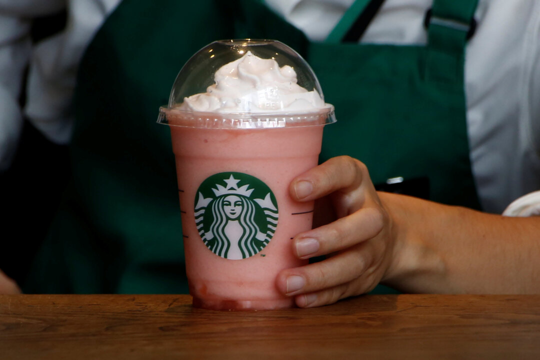 A waitress prepares a beverage at a branch of Starbucks. (Kim Kyung-Hoon/Reuters)