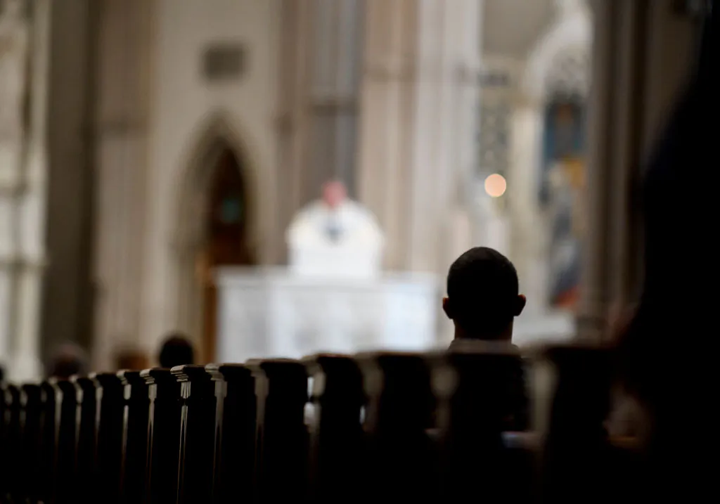 Parishioners worship during a mass at St Paul Cathedral in Pittsburgh, Pennsylvania on Aug. 15, 2018. (Jeff Swensen/Getty Images)