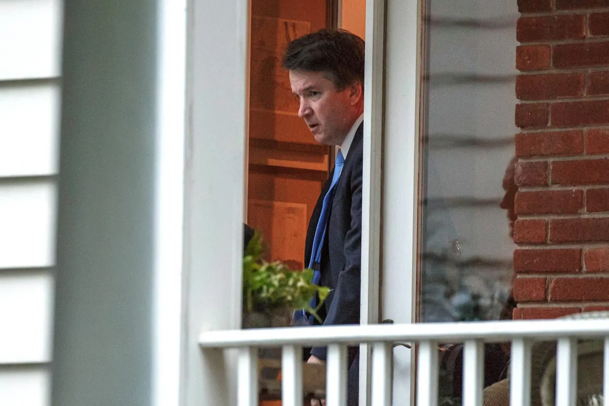 Newly confirmed and sworn-in U.S. Supreme Court Associate Justice Brett Kavanaugh heads off to his first day of work as a justice at the Supreme Court as he leaves his house in Chevy Chase, Maryland, U.S., October 9, 2018.  (Joshua Roberts/Reuters)