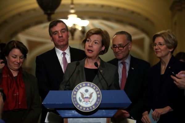 Sen. Tammy Baldwin speaks with Sen. Amy Klobuchar