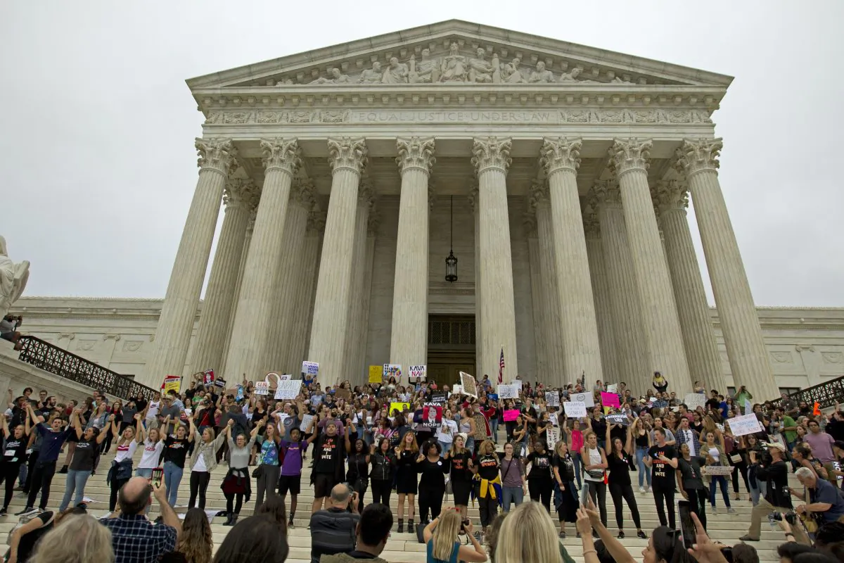 Demonstrators take to the steps of the Supreme  Court as they protest against the appointment of Supreme Court nominee Brett Kavanaugh on Capitol Hill in Washington, Oct. 6, 2018. (Jose Luis Magana / AFP)