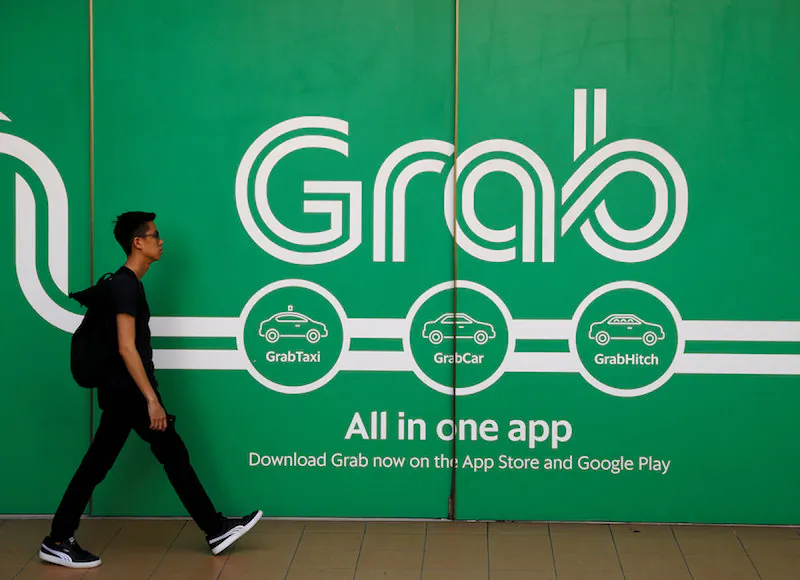A man walks past a Grab office in Singapore March 26, 2018. (Reuters/Edgar Su/File Photo)