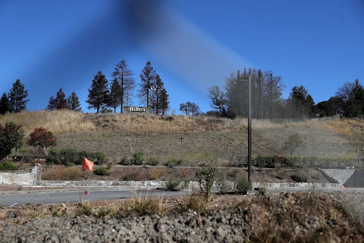 A Hilton sign remains at the site of the Hilton Sonoma Wine Country that was destroyed by the Tubbs Fire one year earlier in Santa Rosa, California, on Oct. 8, 2018. (Justin Sullivan/Getty Images)
