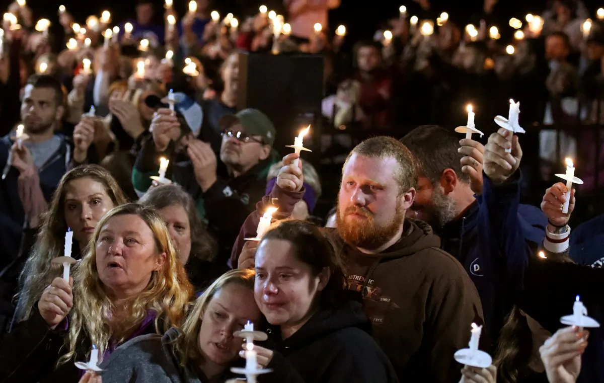 Mourners gather during a candlelight vigil for the victims of a limousine accident in Amsterdam, N.Y., on Oct. 9, 2018.  REUTERS/Cindy Schultz