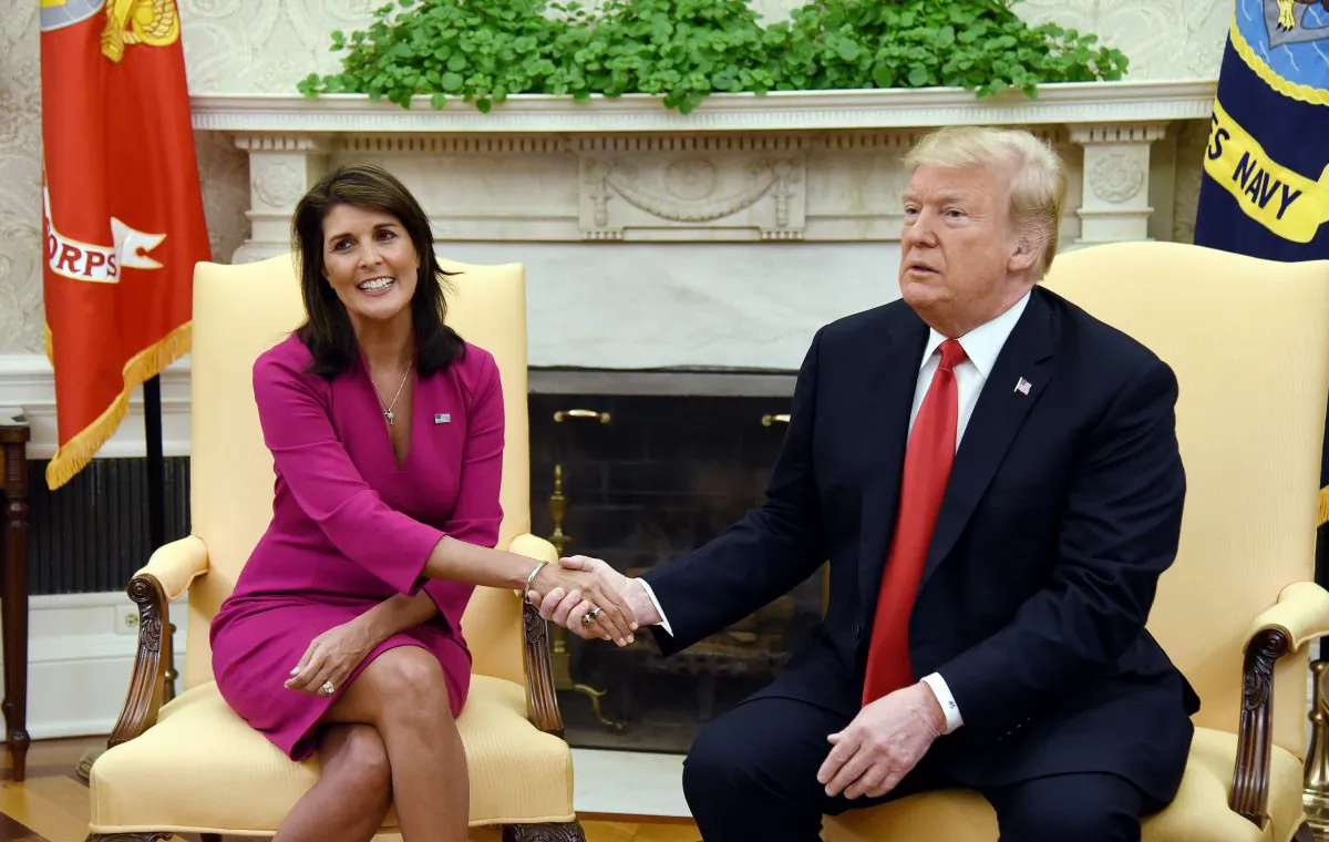 President Donald Trump shakes hands with Nikki Haley, then-U.S Ambassador to the United Nations, in the Oval office of the White House in Washington, on Oct. 9, 2018. (Olivier Douliery/AFP/Getty Images)