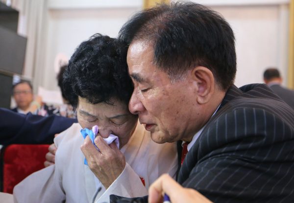 North Korean Jang Gi Sun, 77, cries with her South Korean brother Jang Ju-hwan.