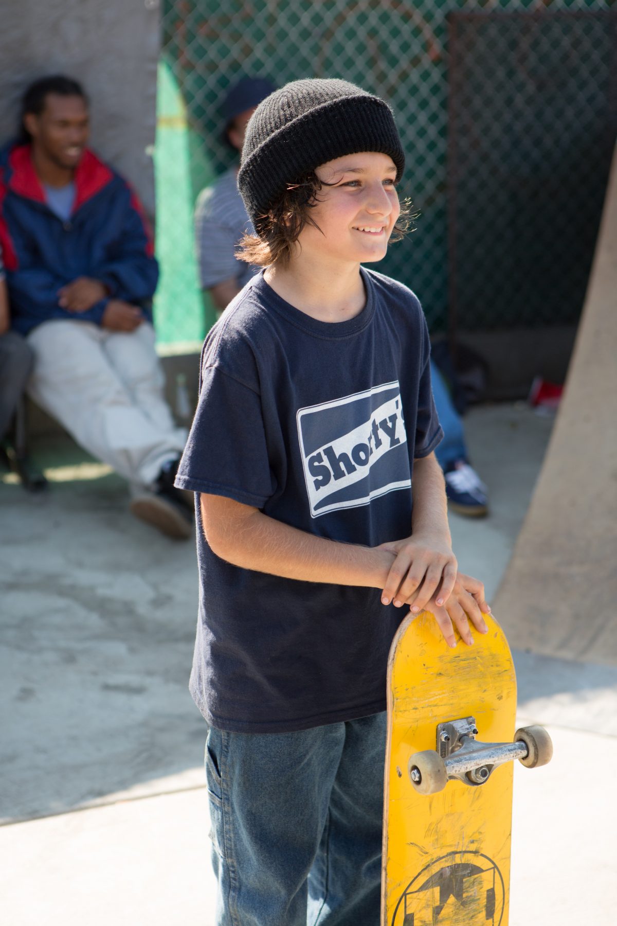 Sunny Suljic holding yellow skateboard