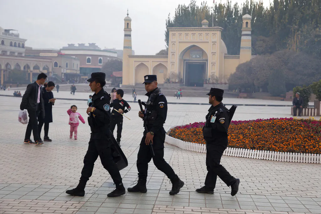 Chinese security personnel patrol near the Id Kah Mosque in Kashgar, Xinjiang region, China on Nov. 4, 2017. (Ng Han Guan/AP)