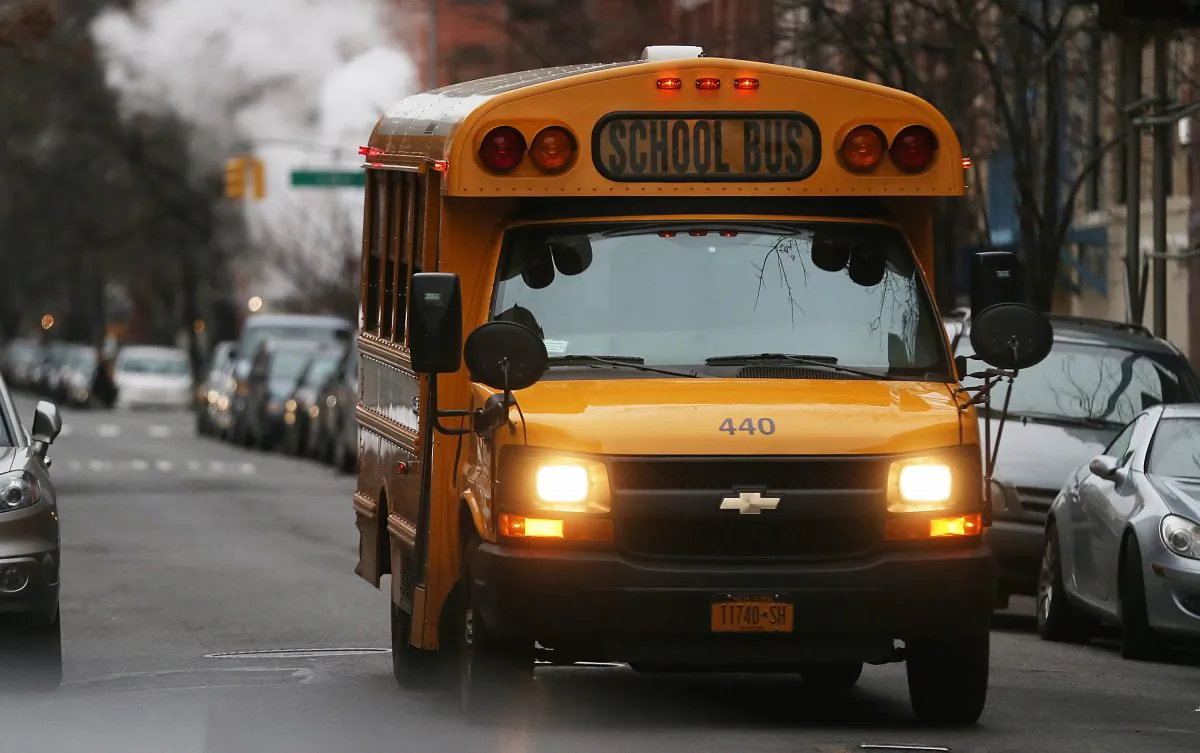 A school bus drives down a street in Manhattan's East Village in New York City on Jan. 15, 2013. (Mario Tama/Getty Images)